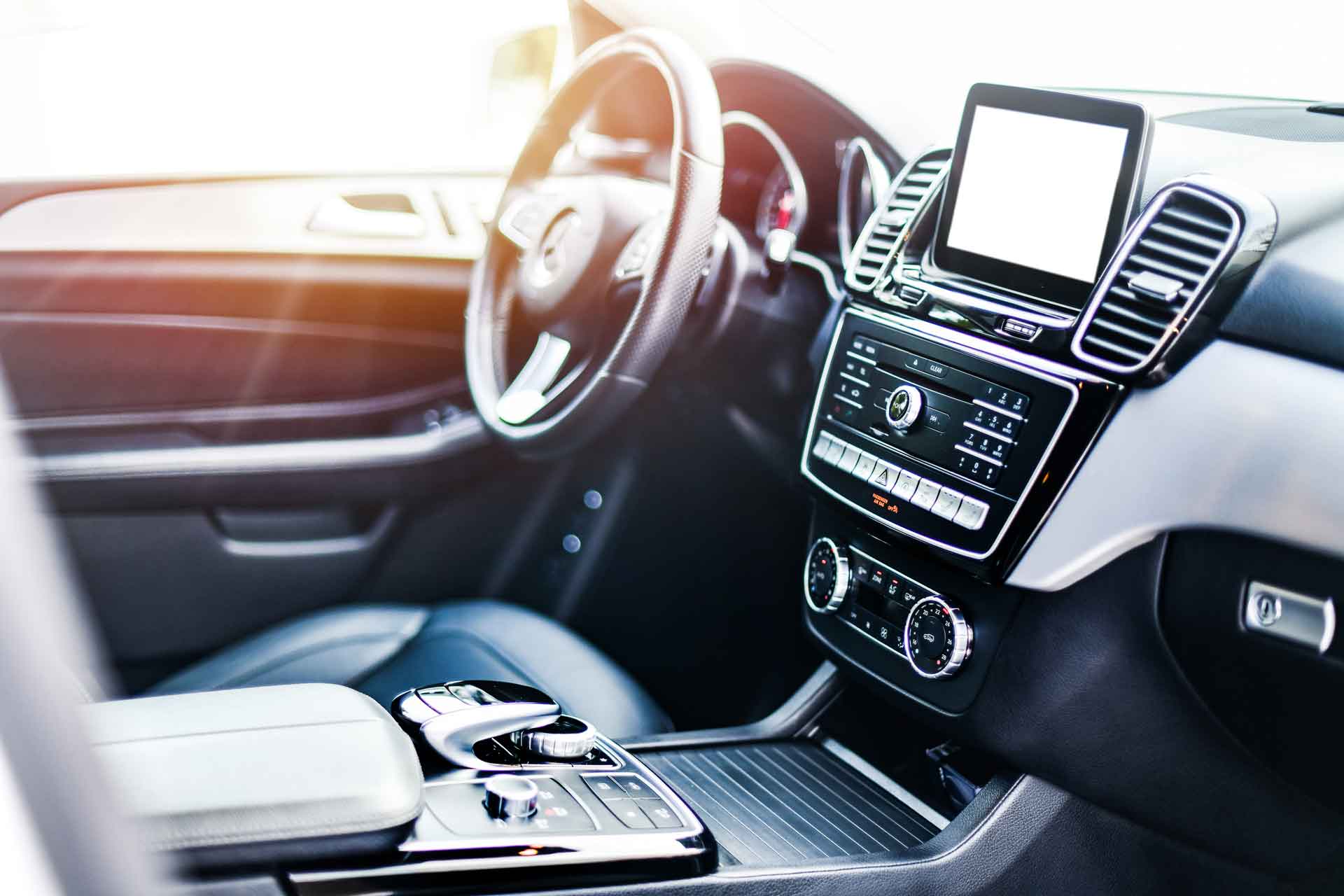 Interior of luxury car showing touchscreen in-dash navigation system